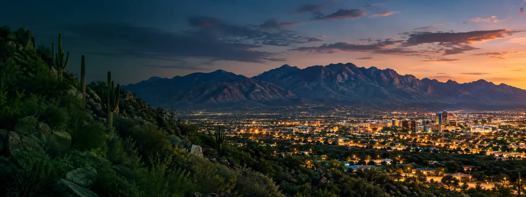 Arizona city lights at dusk below the mountains