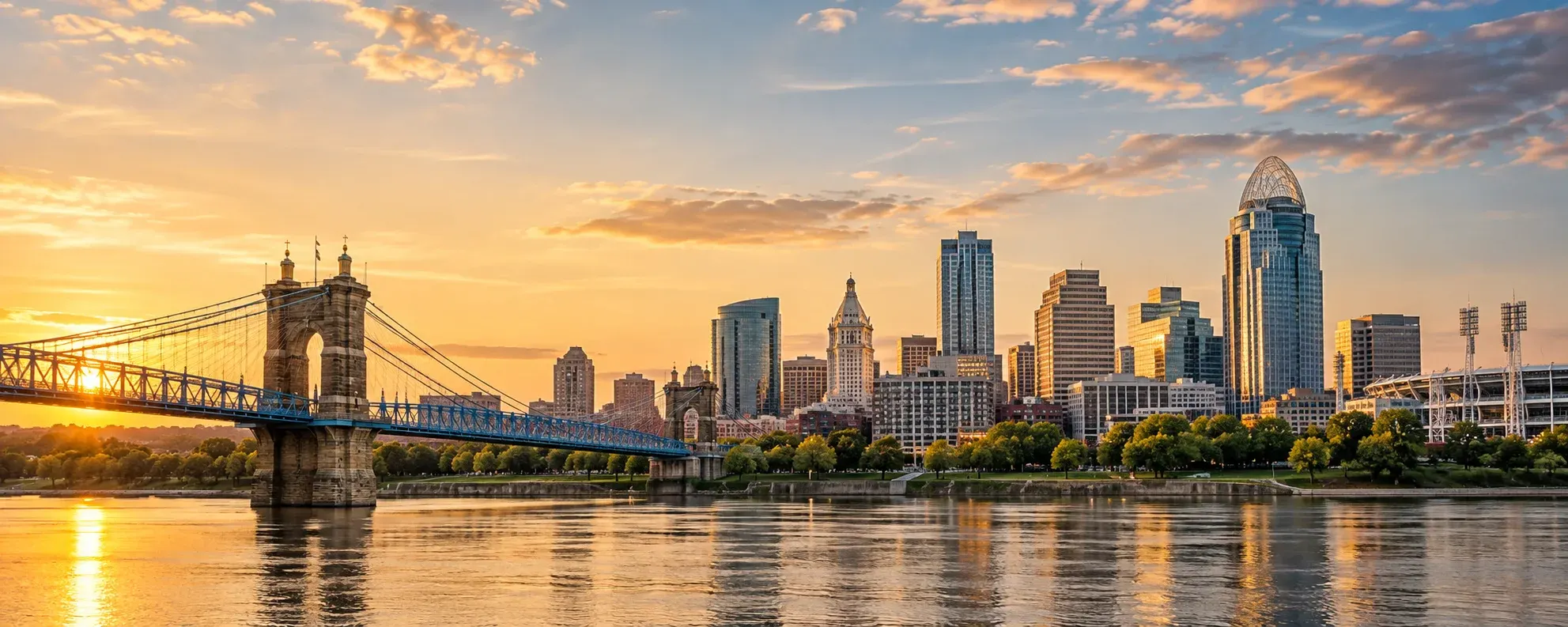 Cincinnati skyline and the Roebling Bridge at sunset, where DevSolutionsAI provides AI services in Cincinnati