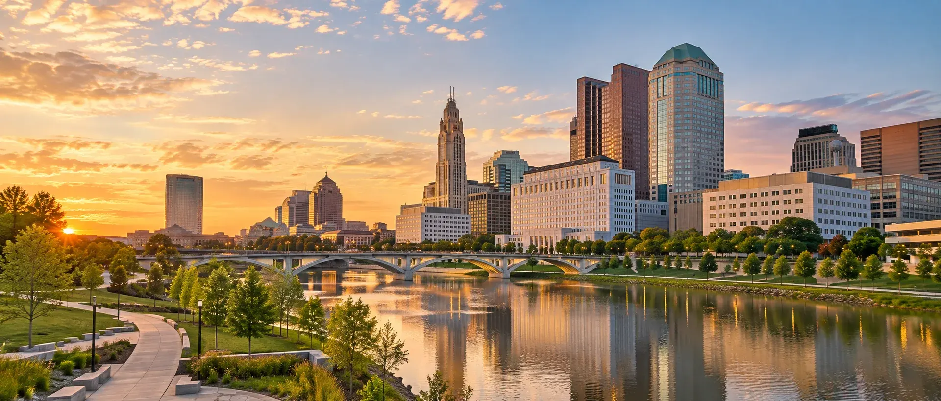 Columbus skyline along the Scioto River at sunset, where DevSolutionsAI provides AI services in Columbus