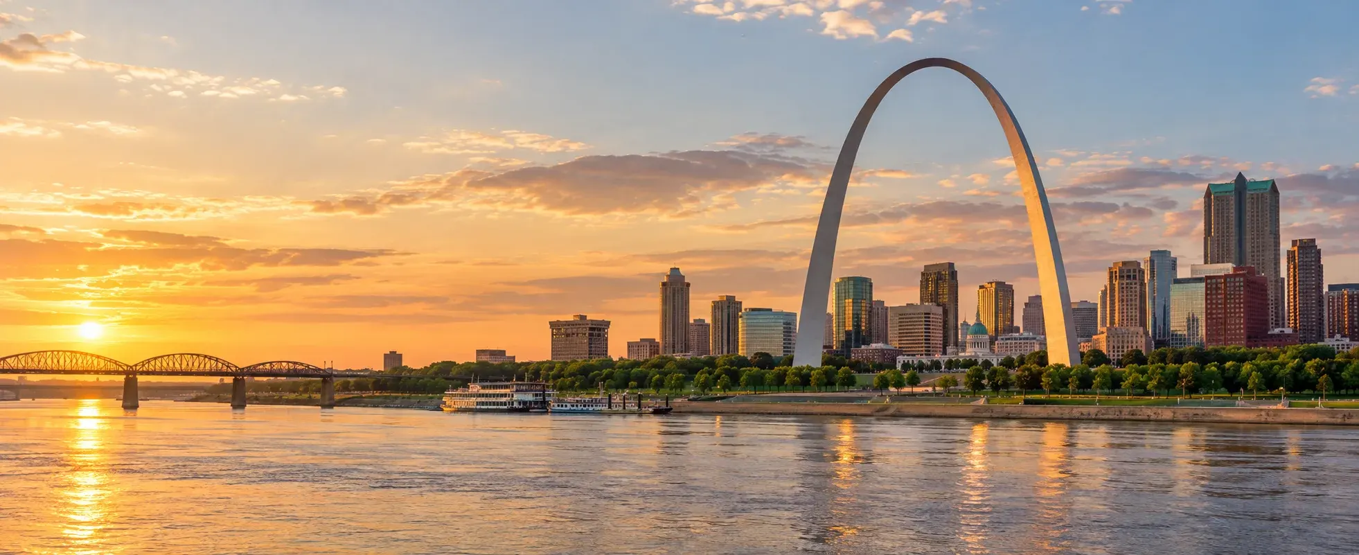 Gateway Arch and the St. Louis riverfront at sunset, where DevSolutionsAI provides AI services in St. Louis