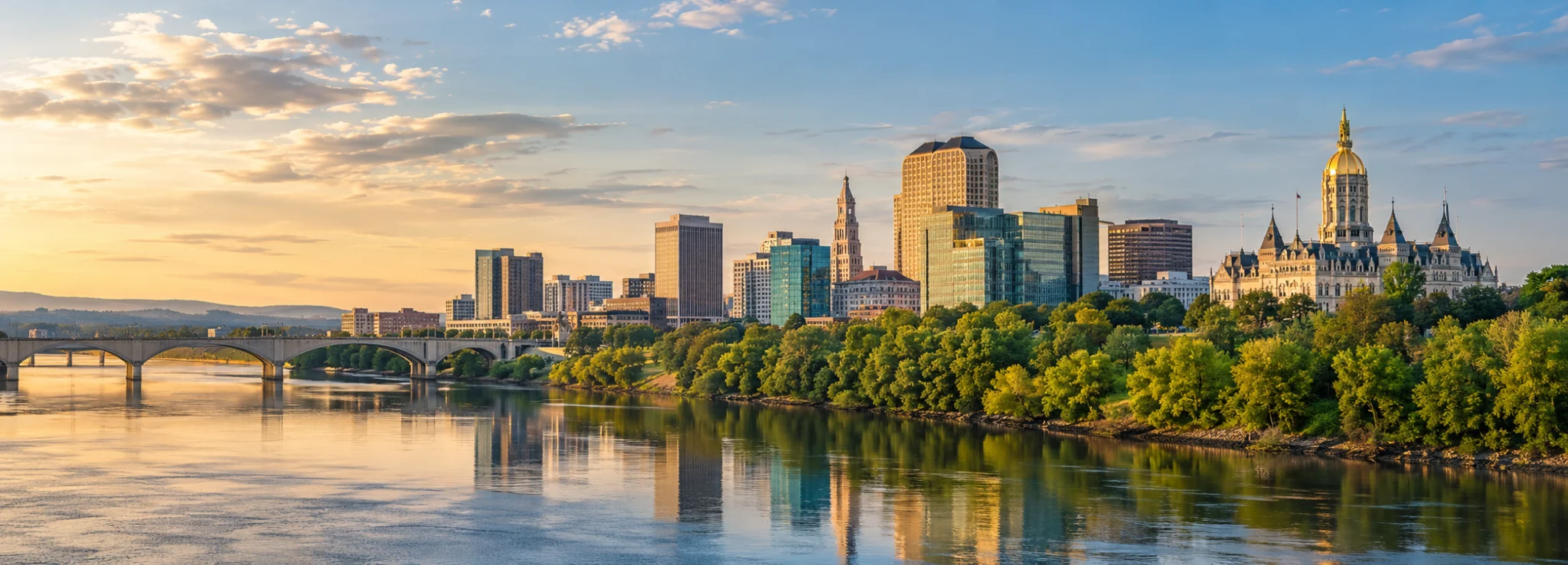 Hartford skyline across the Connecticut River, where DevSolutionsAI provides AI services in Connecticut