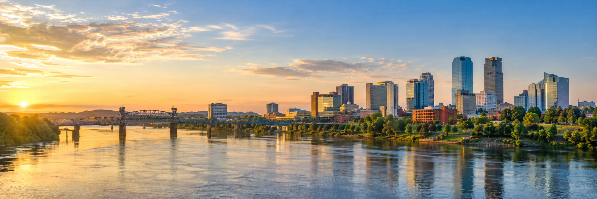 Little Rock skyline along the Arkansas River, where DevSolutionsAI provides AI services in Arkansas