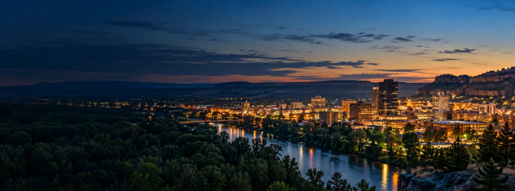 Billings lights below the rimrocks at dusk