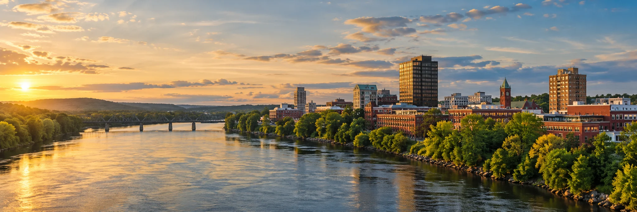 Manchester mill buildings on the Merrimack River, where DevSolutionsAI provides AI services in New Hampshire