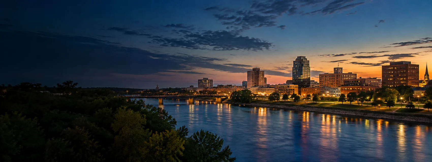 Fargo lights on the river at dusk