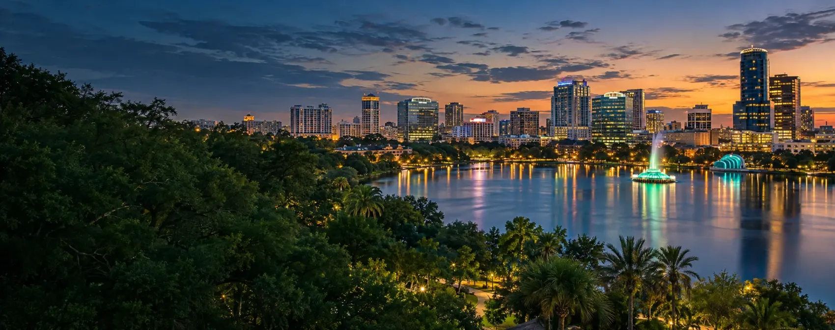 Orlando skyline at dusk across the lake