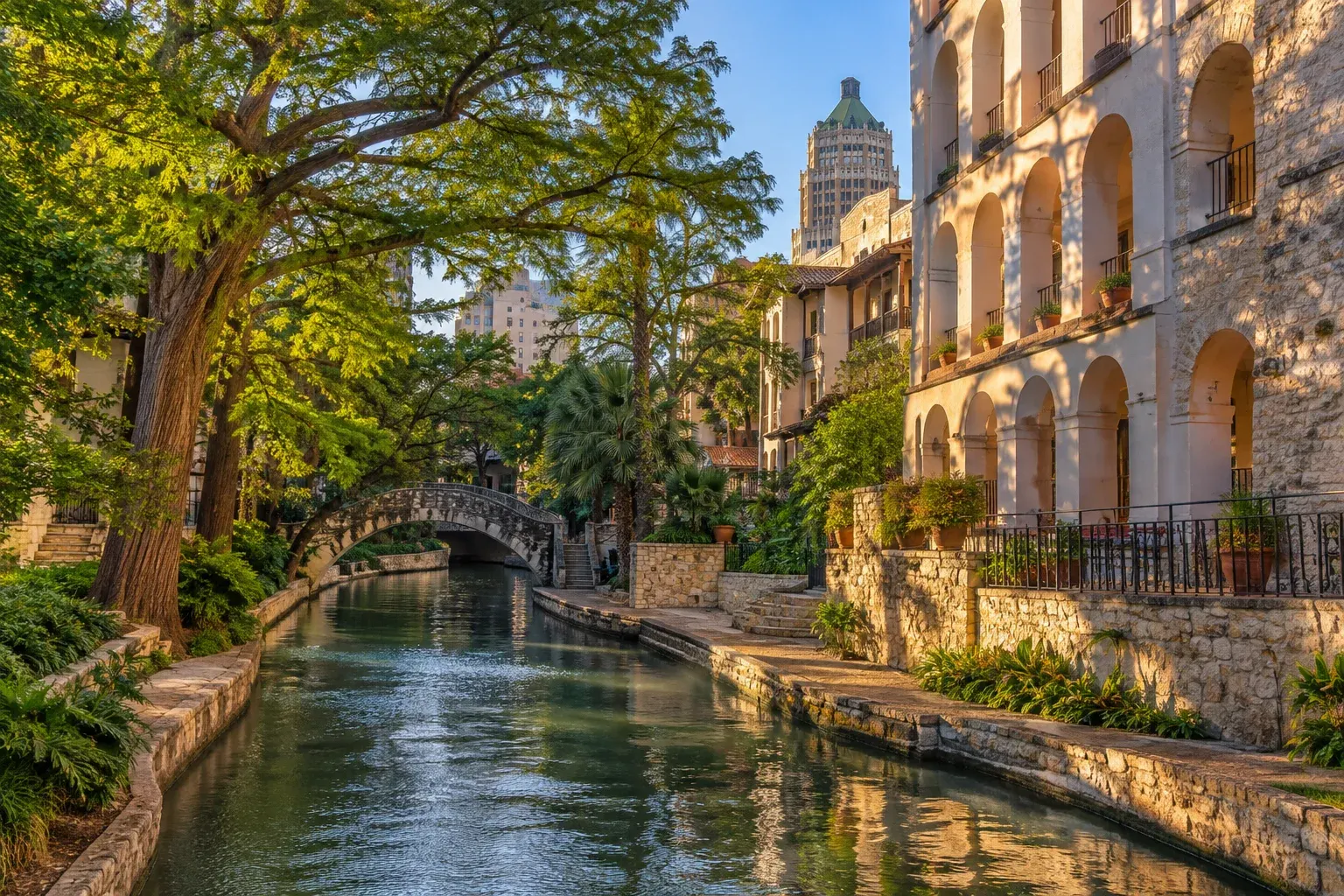 San Antonio River Walk with stone bridges and trees