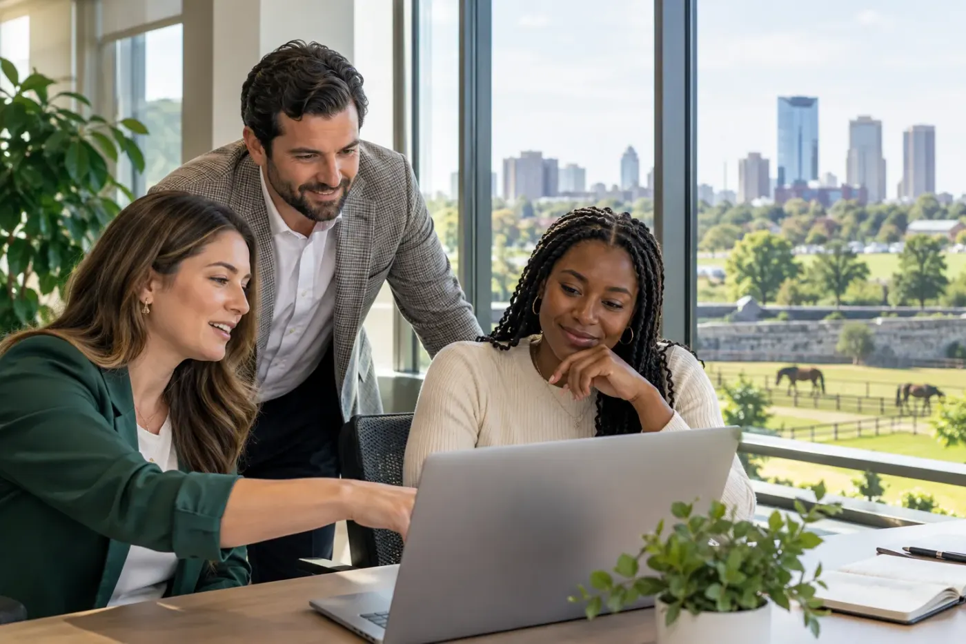 Team working at a laptop in a Kentucky office