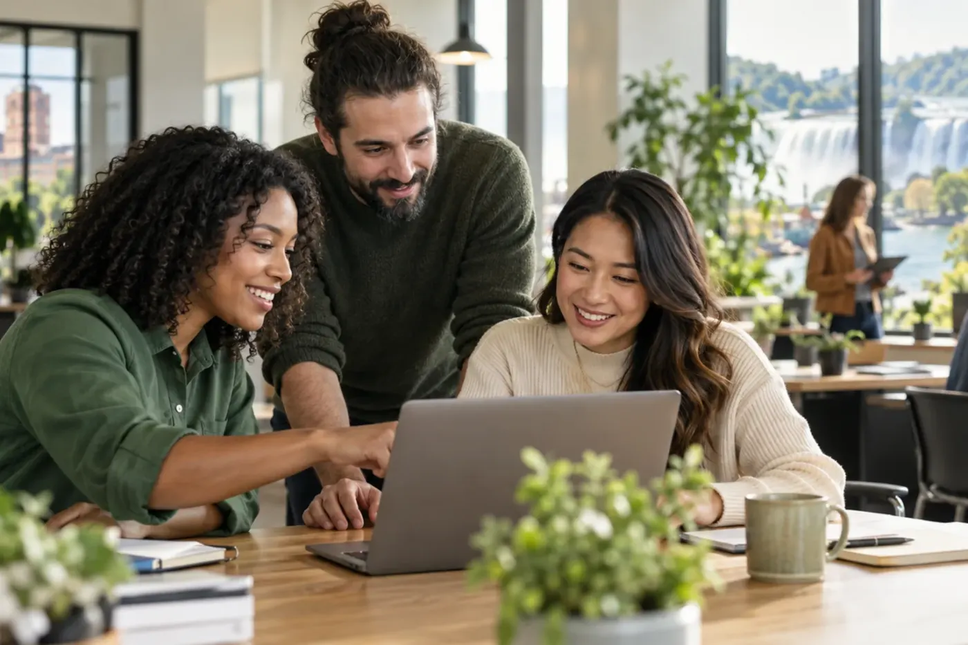 Team working at a laptop in a New York office