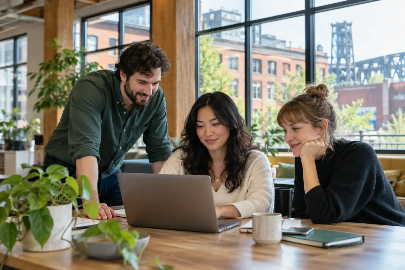 Team working at a laptop in a Portland office